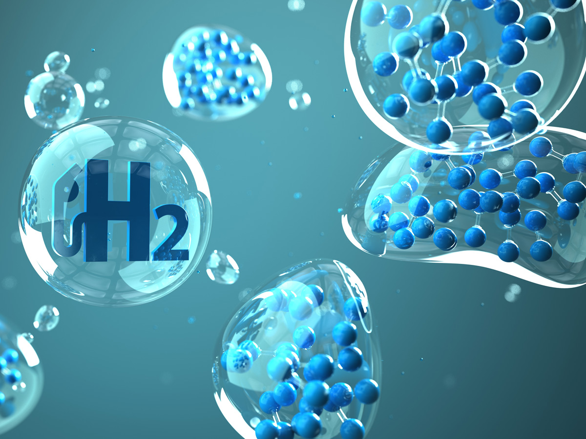 3D Darstellung von Blasen auf hellblauem Hintergrund. In einer sind sie Buchstaben H2 für Wasserstoff abgebildet.